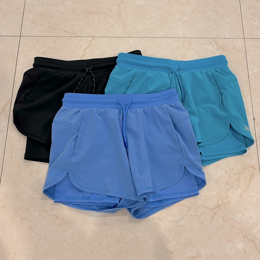 Black, teal, and blue shorts